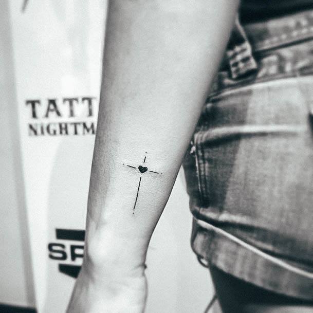 Woman With Fabulous Small Cross Tattoo Design