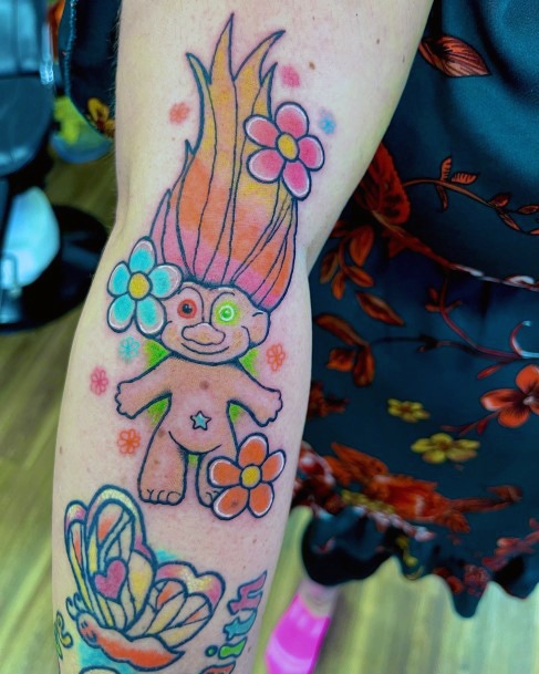 Woman With Fabulous Troll Doll Tattoo Design