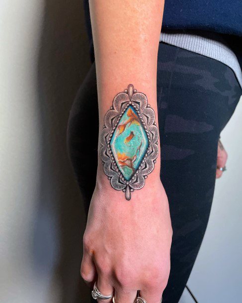 Woman With Fabulous Turquoise Tattoo Design