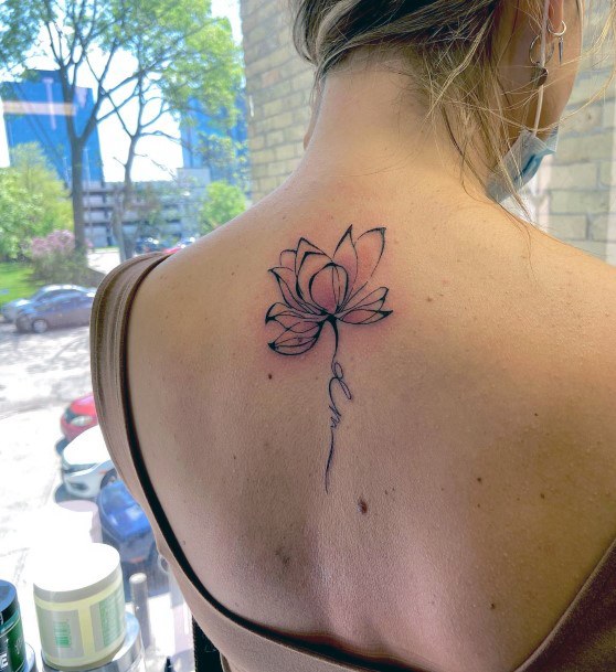 Woman With Fabulous Water Lily Tattoo Design