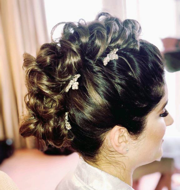 Woman With Fabulous Wavy Hair Pulled Up With Pins Mohawk Design Hairstyle