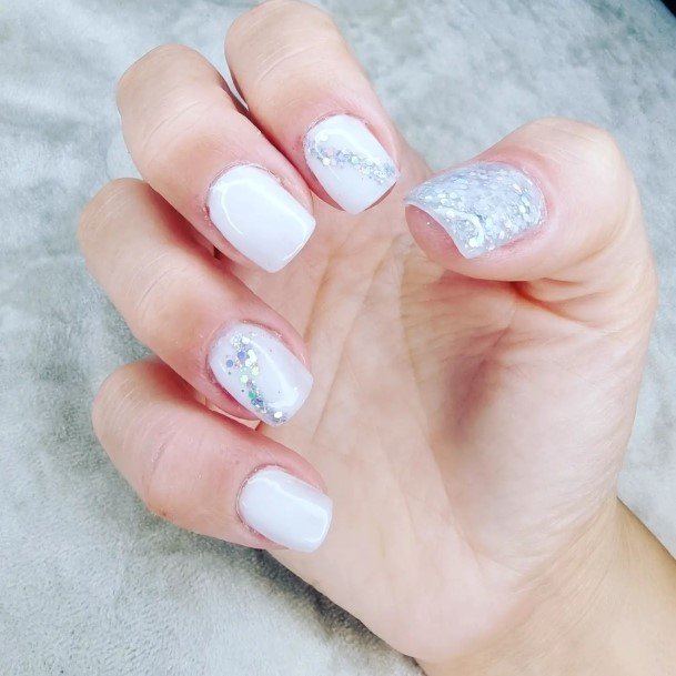 Woman With Fabulous White And Silver Nail Design