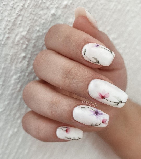 Woman With Fabulous White With Flowers Nail Design