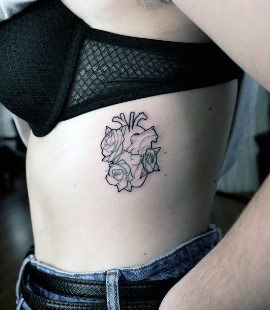 Woman With Flower Heart Tattoo