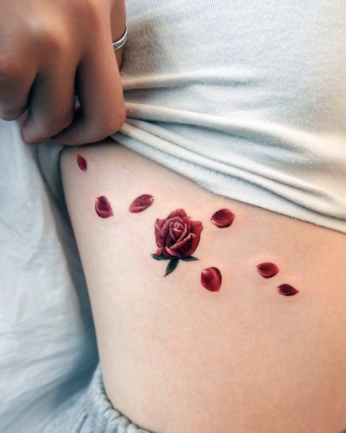 Woman With Flower Petal Tattoo