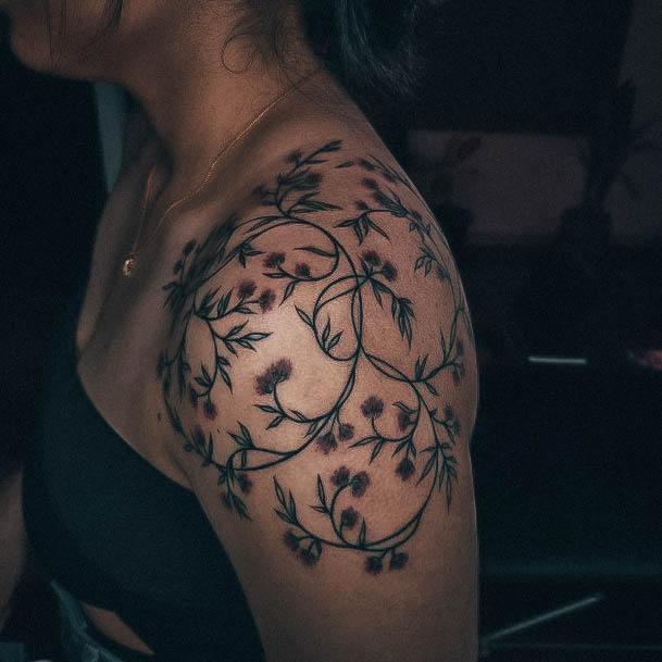 Woman With Flower Shoulder Tattoo