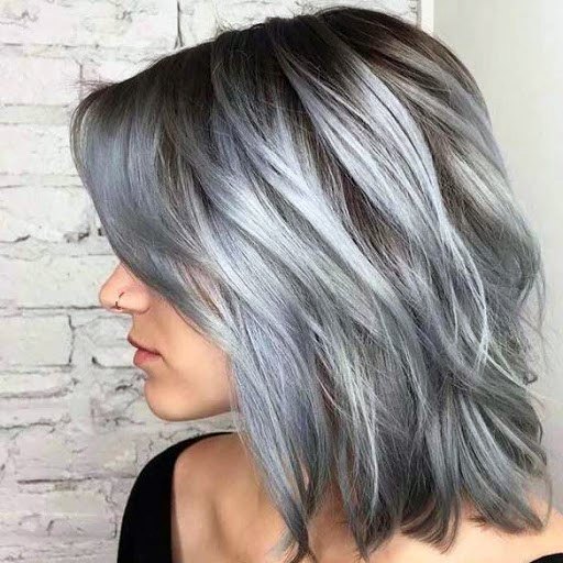 Woman With Grey And Shades Of Pale Beautiful Purple Bluish Color In Hair