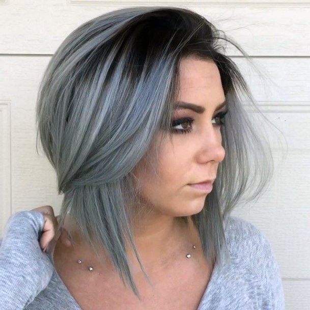 Woman With Half Length Black Hair To Darker Grey Tipped Color Hairstyle