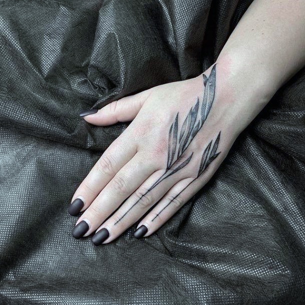 Woman With Leaf Tattoo On Hand
