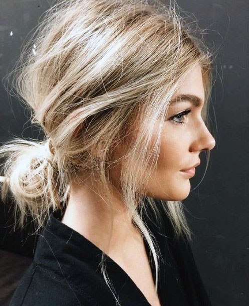 Woman With Light Blonde Autumn Messy Back Bun And Slight Front Waves