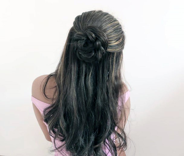 Woman With Long Brown Wavy Hair And Half Up Pull Back Into Large Bun