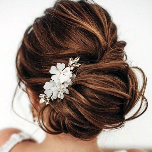 Woman With Low Bun Pretty Formal Updo Flower Clip Hairstyle Ideas