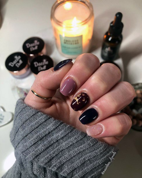 Woman With Maroon And Black Nail