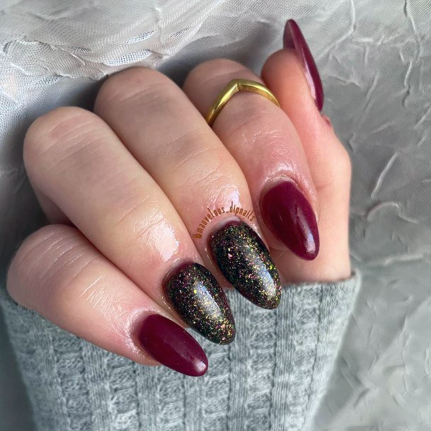 Woman With Maroon Glitter Nail