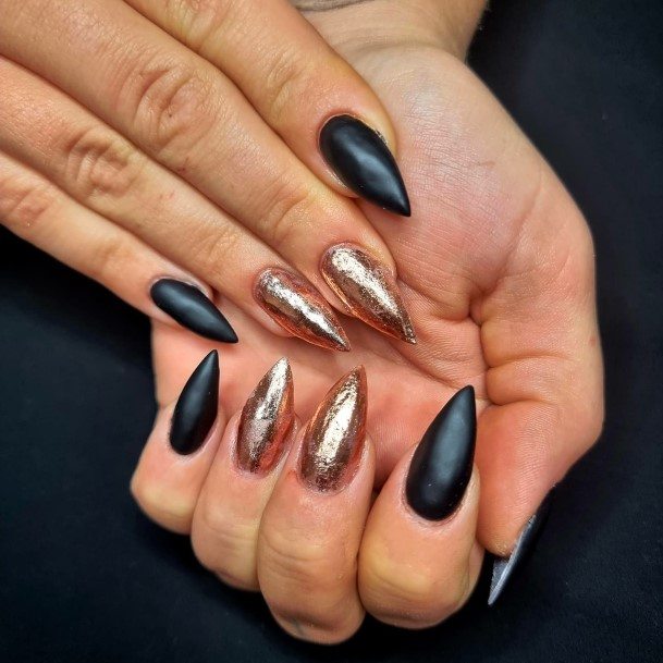 Woman With Matte Black And Gold Nail