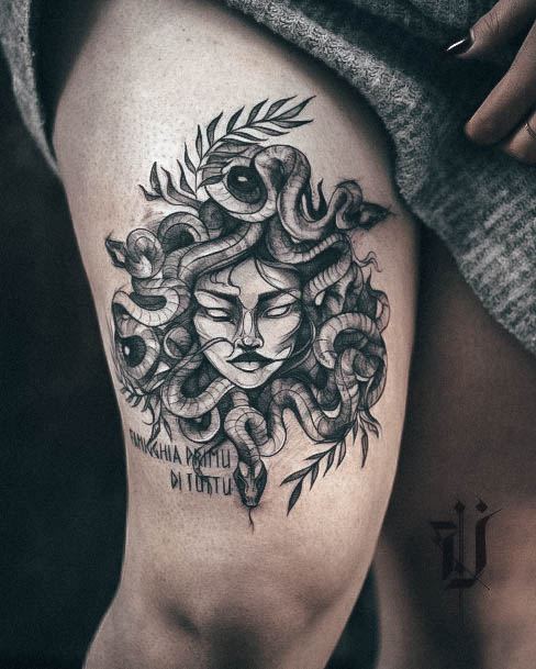 Woman With Medusa Tattoo Thigh