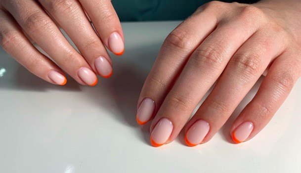 Woman With Orange French Tip Nail