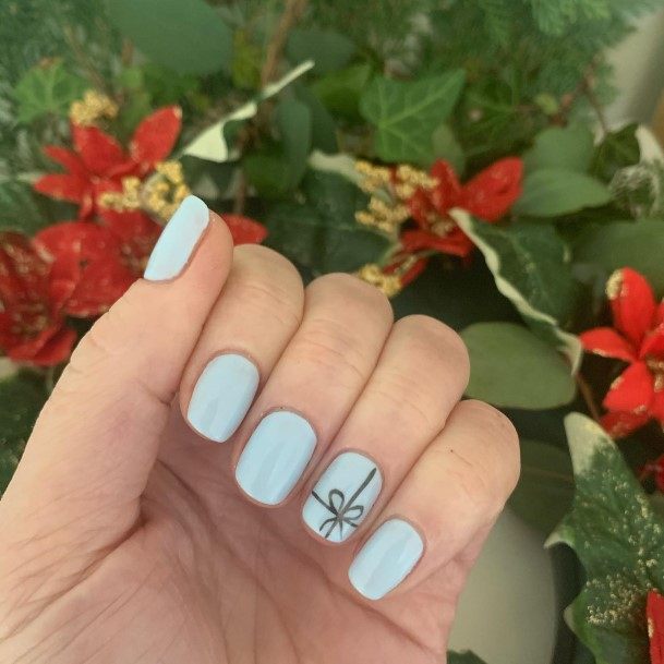Woman With Pale Blue Nail