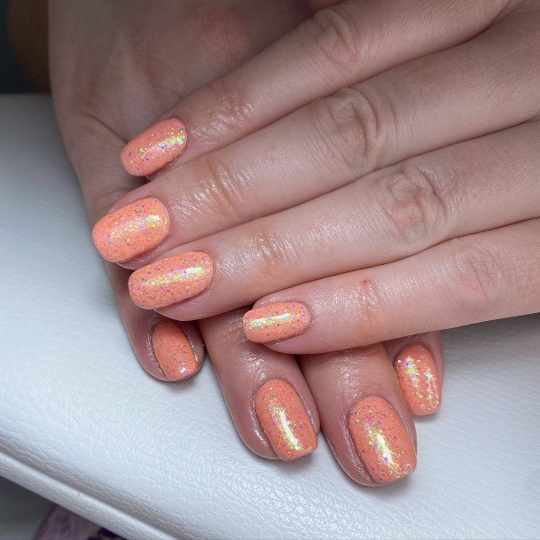 Woman With Peach With Glitter Nail