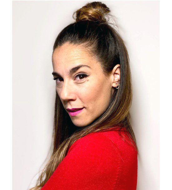 Woman With Shoulder Length Brown Hair In Top Knot Hairstyle