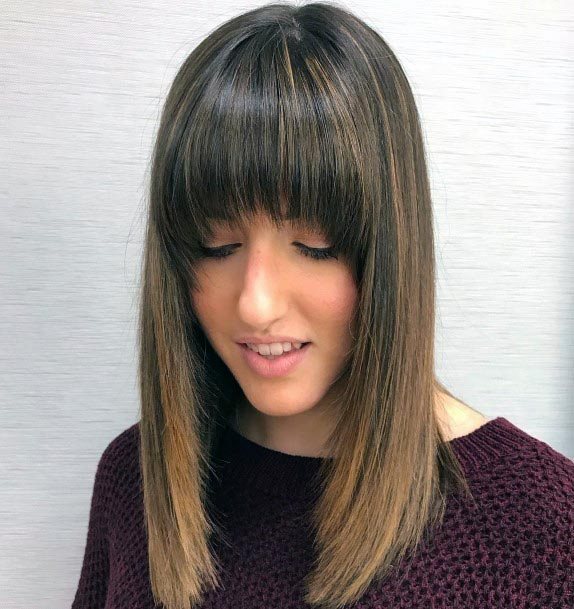 Woman With Shoulder Length Hair Long Layers And Bangs