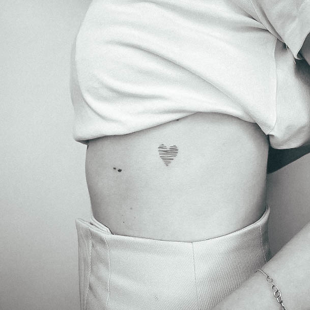 Woman With Small Heart Tattoo