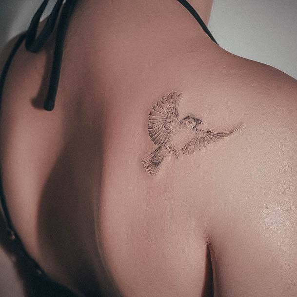 Woman With Small Sparrow Tattoo