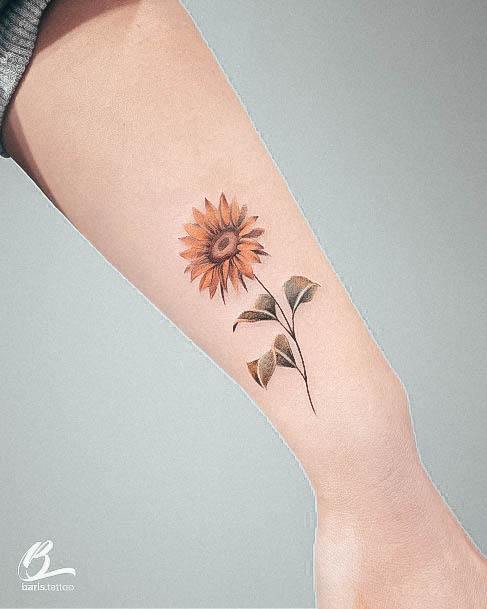 Woman With Small Sunflower Tattoo