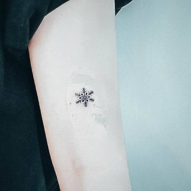 Woman With Snowflake Tattoo