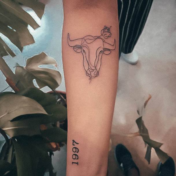 Woman With Taurus Tattoo