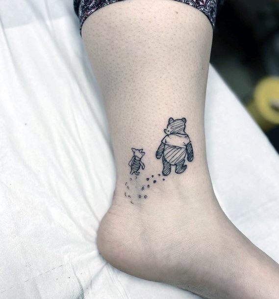 Woman With Winnie The Pooh Tattoo