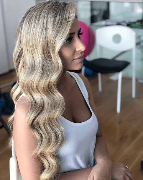 Womans Polished And Elegant Long Blonde Old Hollywood Waves Hairstyle