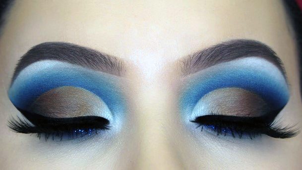 Women Brown Eyeshadow With Blue On Brows