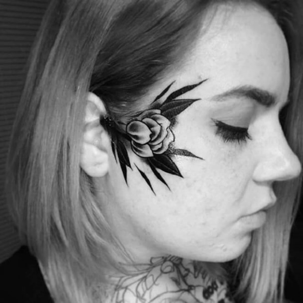 Women Face Dark Leaves Tattoo
