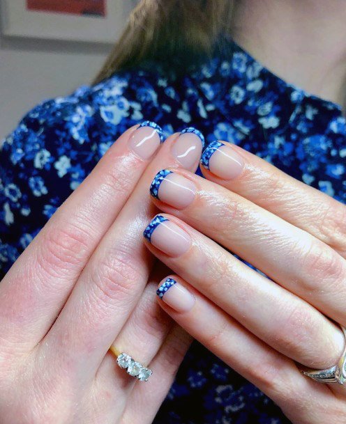 Women Nails With Glossy Blue Design On Tips