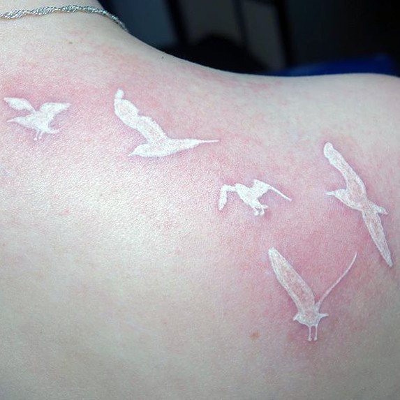 Womens Back White Ink Bird Tattoo