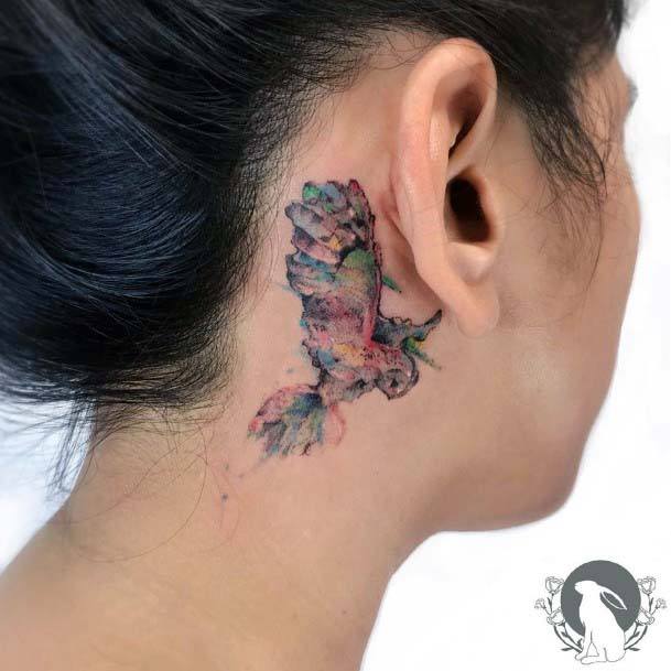 Womens Behind The Ear Smudged Bird Tattoo