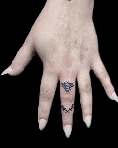 Womens Black Fly Tattoo Fingers