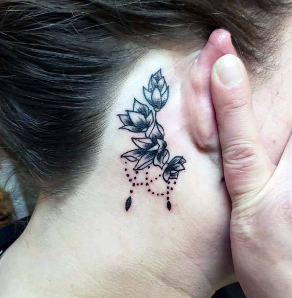 Womens Black Inked Flowers Tattoo Behind The Ear