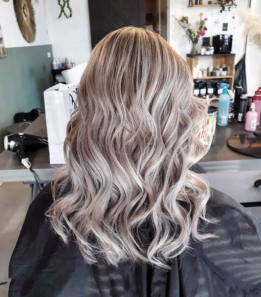 Womens Bold Silver Platinum Highlights In Voluminous Curly Hair