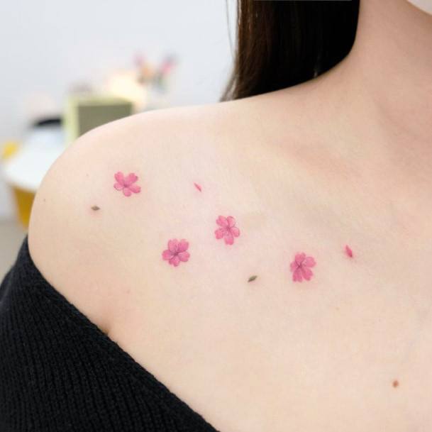 Womens Collar Bone Smattering Of Cherry Blossom Tattoo