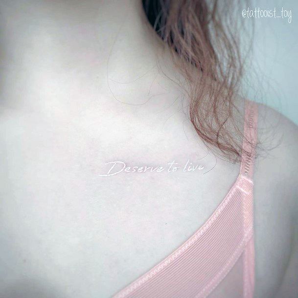 Womens Collar Bone Wordings White Ink Tattoo
