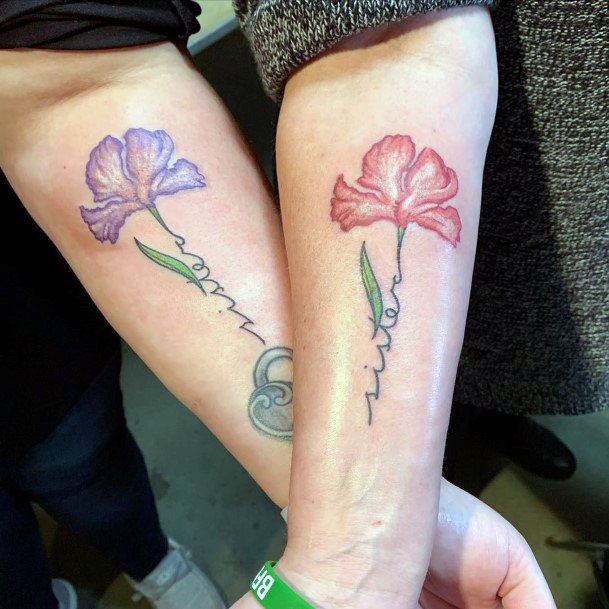Womens Colored Petal Sister Tattoo On Forearms