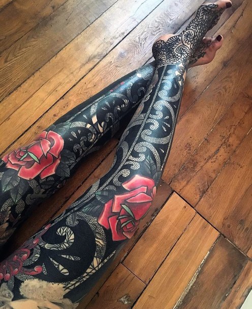 Womens Dark Ink With Red Tattoo Legs