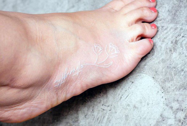 Womens Feet Flowers White Ink Tattoo