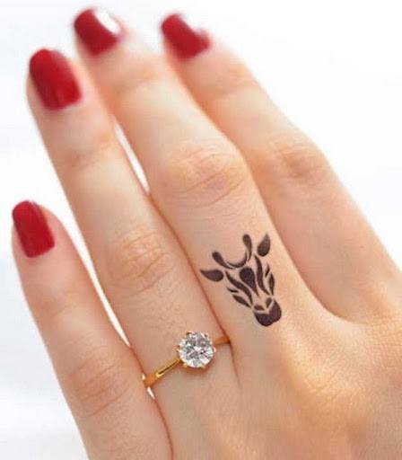 Womens Fingers Horned Beast Tattoo