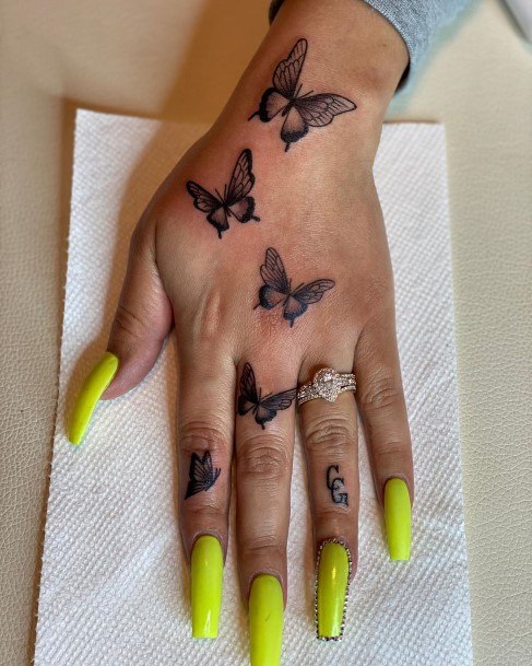 Womens Hand Flying Butterfly Tattoo
