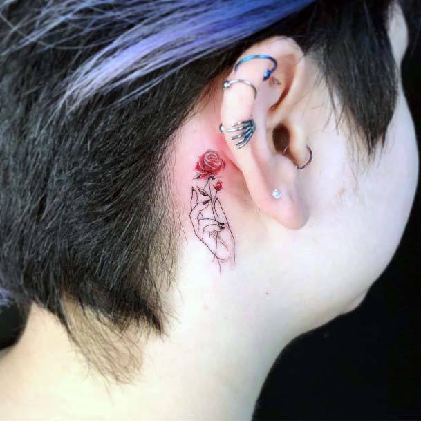 Womens Hand Holding Rose Tattoo Behind The Ear