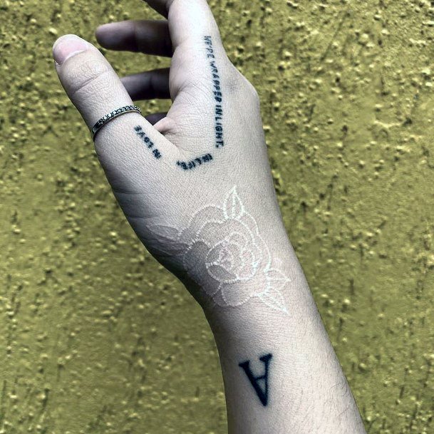 Womens Hand White Ink Flower Tattoo
