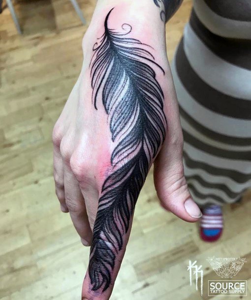 Womens Hands Dark Inked Feather Tattoo